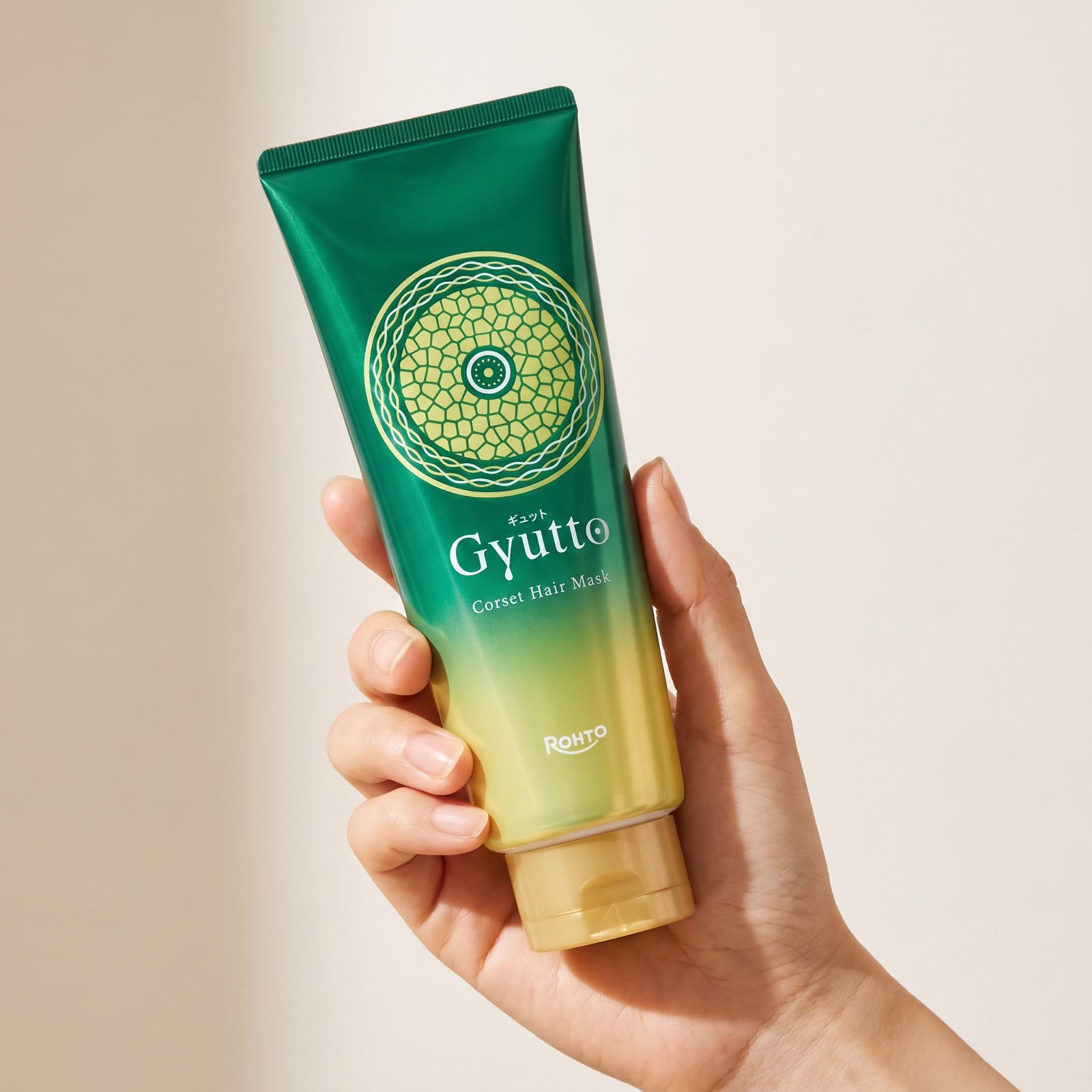 Gyutto Corset Hair Mask 200g held in hand