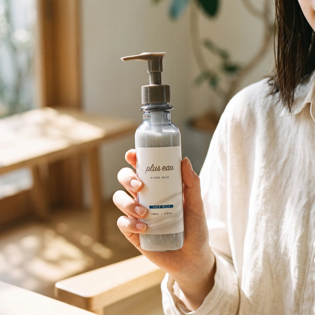 Plus Eau Hydro Milk 150ml — on hand lifestyle view