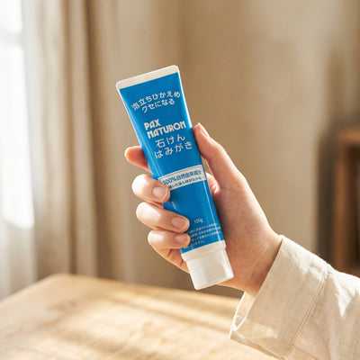 Pax Naturon Soap Toothpaste 120g — Held in hand
