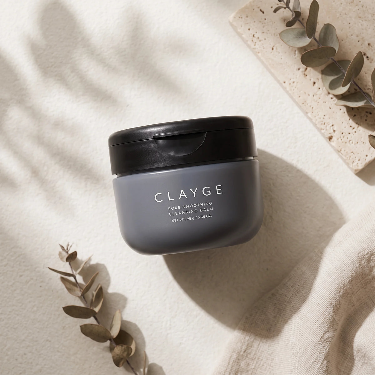 CLAYGE Pore Smoothing Cleansing Balm Black 95g — TOP ANGLE lifestyle view