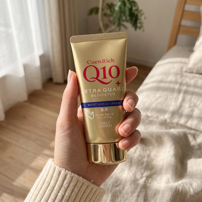 Kose Coenrich Q10 Extra Guard Hand Cream 80g — on hand lifestyle view
