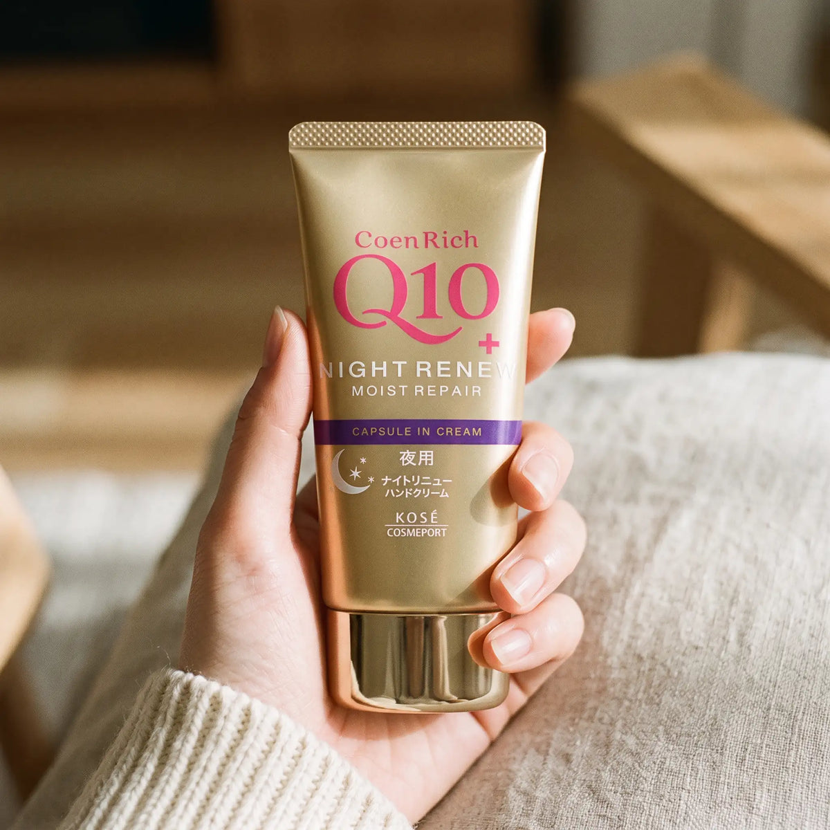 Kose Coenrich Q10 Night Renew Hand Cream 80g — on hand lifestyle view
