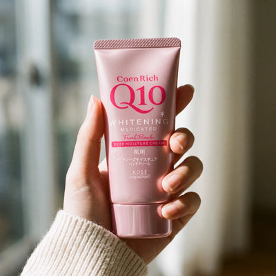 Kose Coenrich Q10 Whitening Fresh Peach Hand Cream 80g — on hand lifestyle view