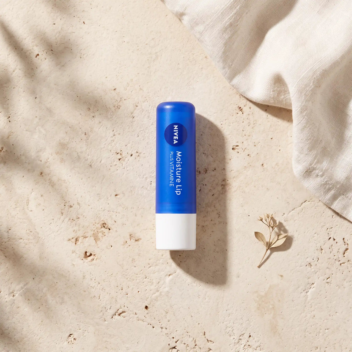 Nivea Japan Moisture Lip Plus Vitamin E 3.9g — top angle lifestyle view