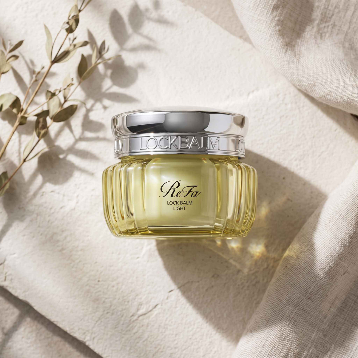 ReFa Lock Balm Light 50g — TOP ANGLE lifestyle image