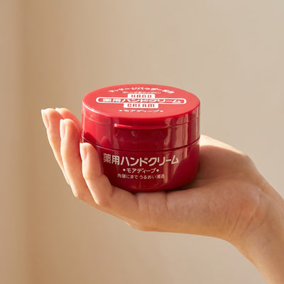 Shiseido Fine Today More Deep Medicated Hand Cream 100g - held in hand